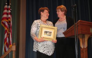 Longtime Unionville Fair  board member Bonnie Musser (right) congratulates Berta Rains, who was honored for her longtime dedication to the fair.