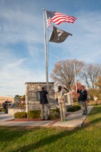 Changing the flags at the Concord Township American Hero Memorial.