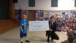Farouk Al-Azzam shows off the $18,000 check he presented to Chris Callanan, the director of event and corporate development for the Philadelphia Ronald McDonald House. 