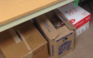 After troopers wrapped the gifts, they were sorted into three cartons and tucked under the table that had doubled as a gift-wrapping station.