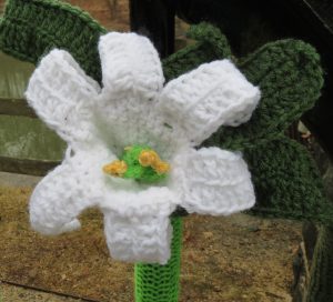 Lilies are among the crocheted flowers adorning the Hagley Museum entrance that drew their inspiration from a rug on display inside. 