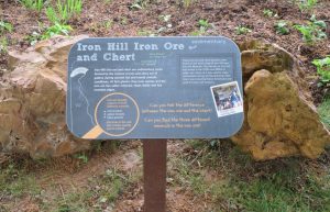 The boulders are accompanied by signage that provides information about their formation and use.