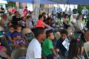 A diverse crowd enjoys watching the interviews during Kennett Square's version of National Night Out.