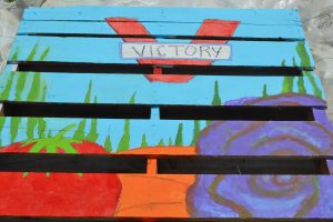 One of the pallets the youth designed shows what they have been harvesting.