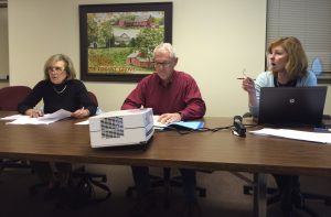 Pocopson Township Supervisors Georgia Brutscher (from left) and Barney Leonard listen as Peggy Lennon, the township's treasurer, explains numbers in the draft budget for 2016.