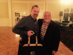 Jim McKinley receives prize kit from Larry Ferriola.
