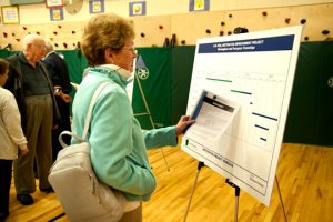 Pennsbury's Lynn Luft examines a chart showing the timeline for the work.