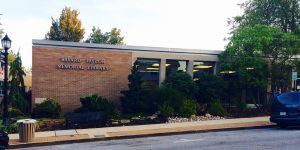 The Kennett Public Library facade displays the facility's former name: The Bayard Taylor Memorial Library.