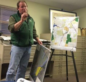 Jack Stefferud from Natural Lands Trust uses maps to explain an effort to protect land at Castle Rock Farm, 16 acres of which lie within Pocopson Township.