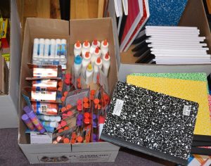 An assortment of notebooks, paper, and writing implements will be distributed to young crime victims.