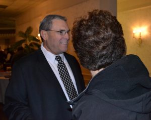 Former Police Chief Edward A. Zunino shares a laugh will well-wishers during his retirement celebration.