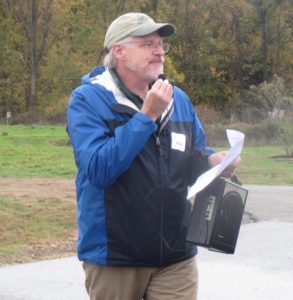 Oliver P. Bass issues instructions as racers get ready to take off.