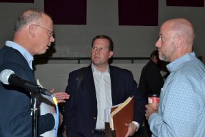 After the meeting, John Snook (left), an East Bradford Township supervisor and planner for the Brandywine Conservancy, chats with Toll representatives Greg and Andrew J. Semon.