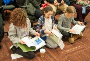 Students react to seeing their art published in "The Everyday Rules of Spectacular Parents."